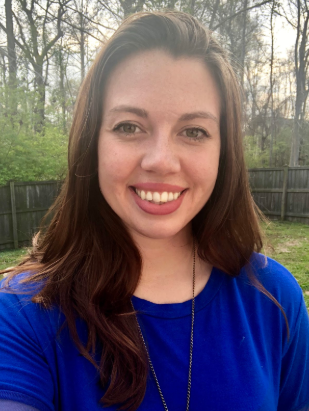 Mom smiling in a blue shirt outdoors 