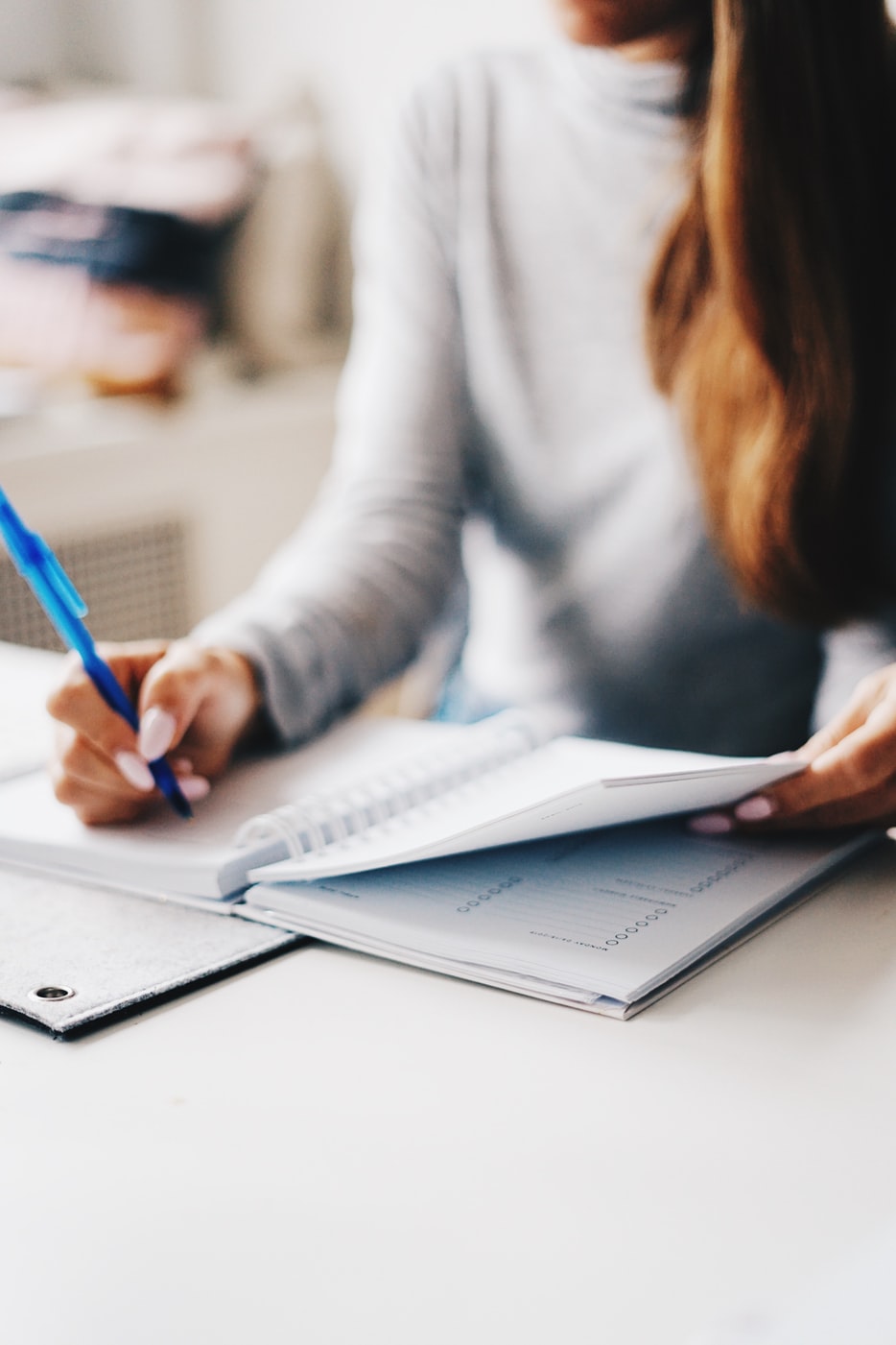 woman writing in planner