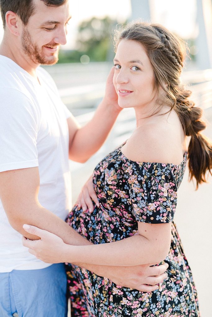 A man looking lovingly at his pregnant wife