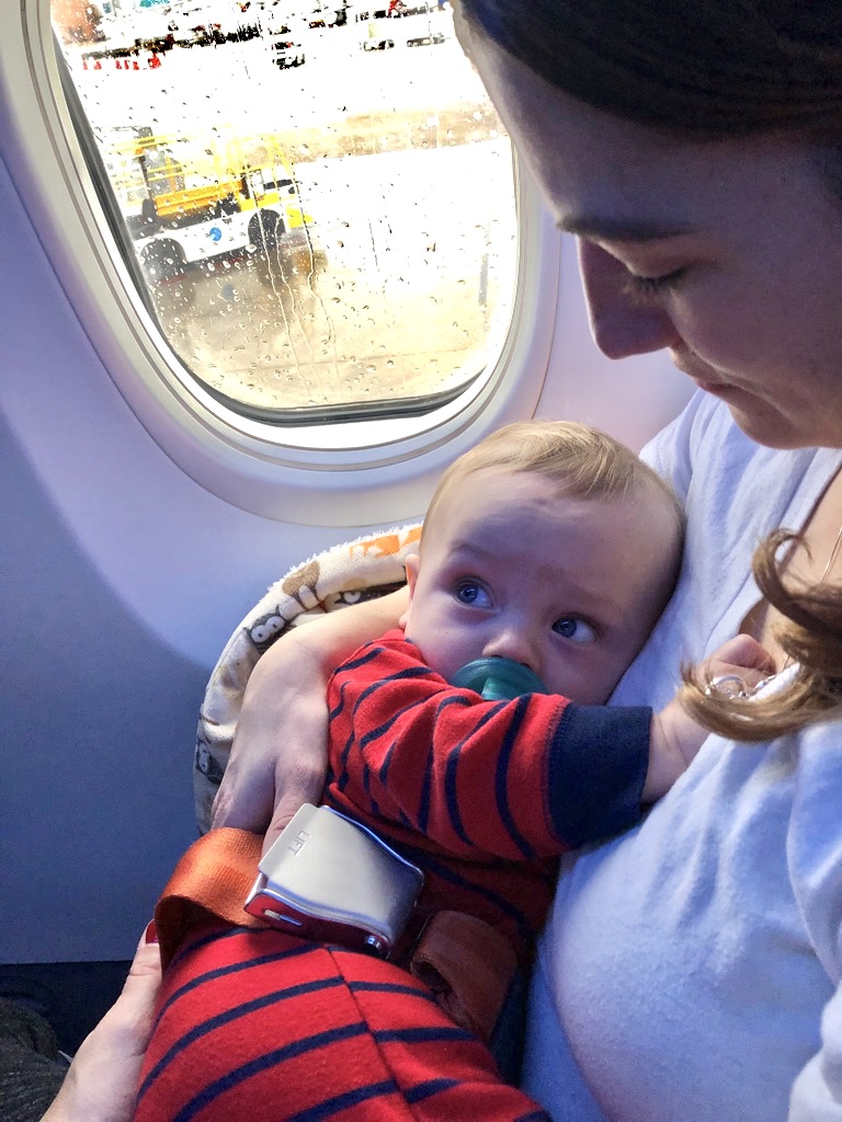 mom traveling thinking about breastfeeding while flying