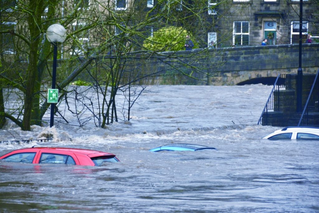 cars under water during city flooding