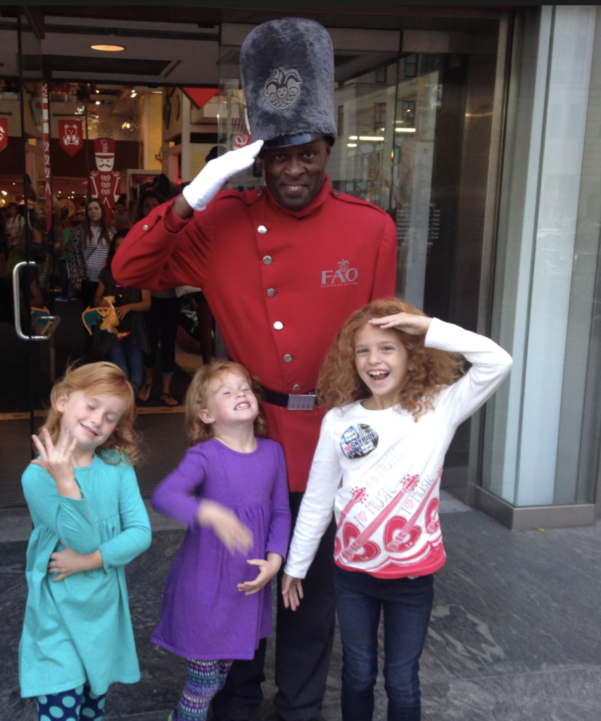 Three girls visiting FAO store for photos.