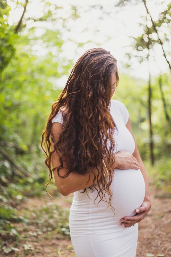 pregnant outdoors in woods
