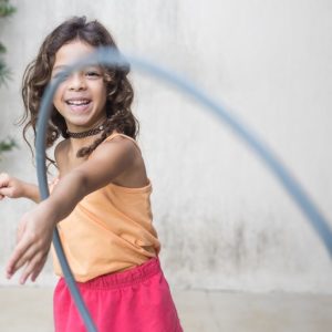 girl playing with a hula hoop