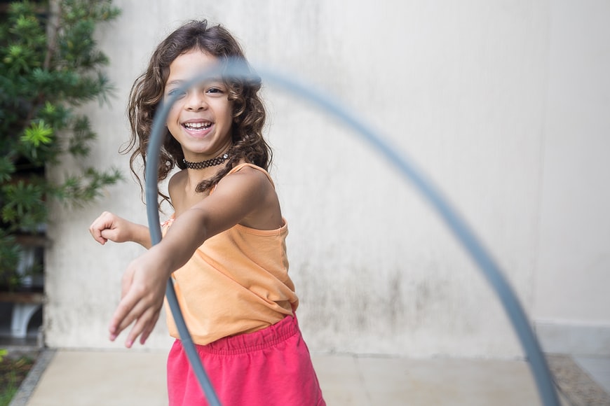 girl playing with a hula hoop