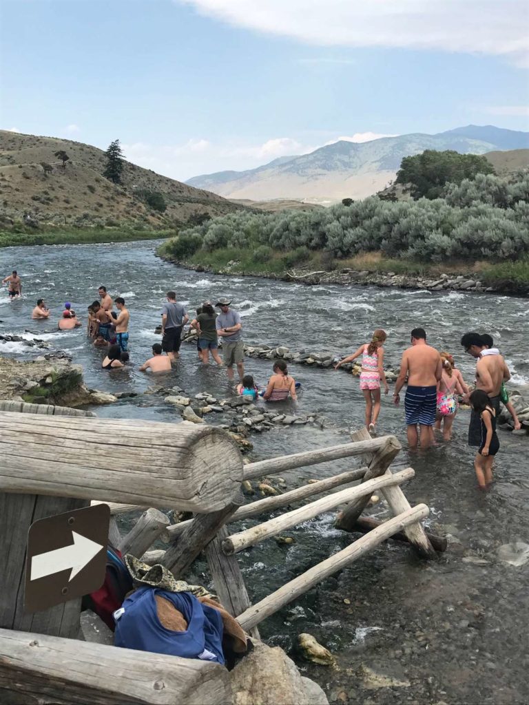 Families visiting hot springs in Yellowstone National Park