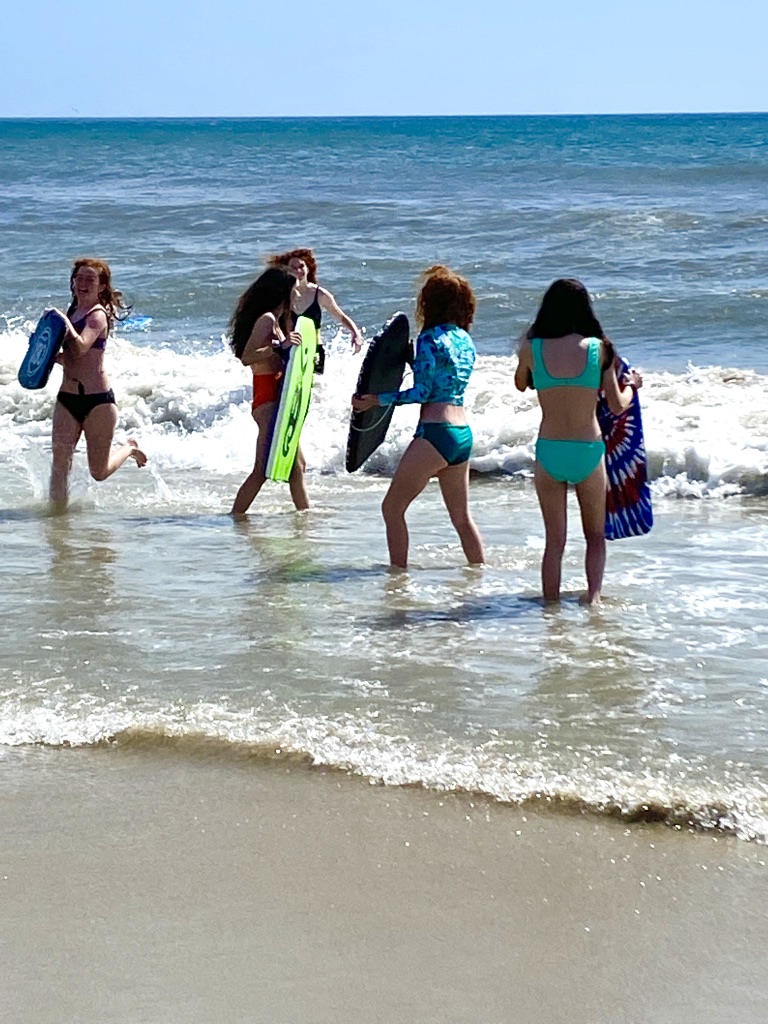 children playing at beach without cell phones