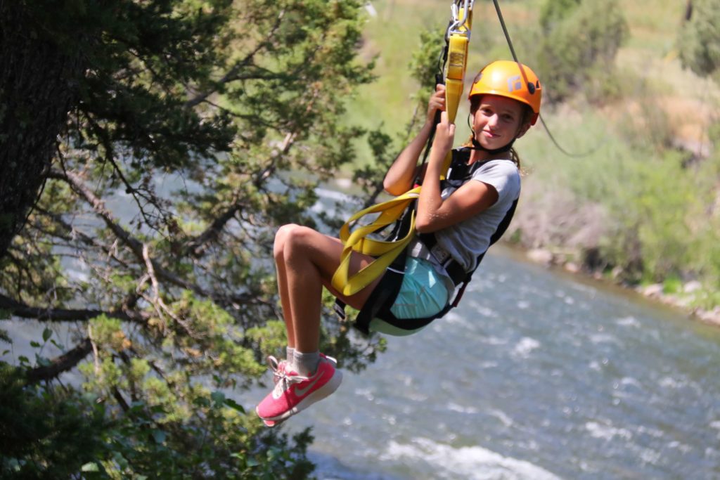 Girl ziplining at Yellowstone
