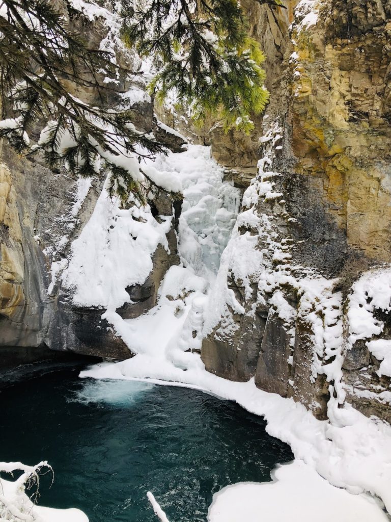 Snow surrounding aake in Banff Canada