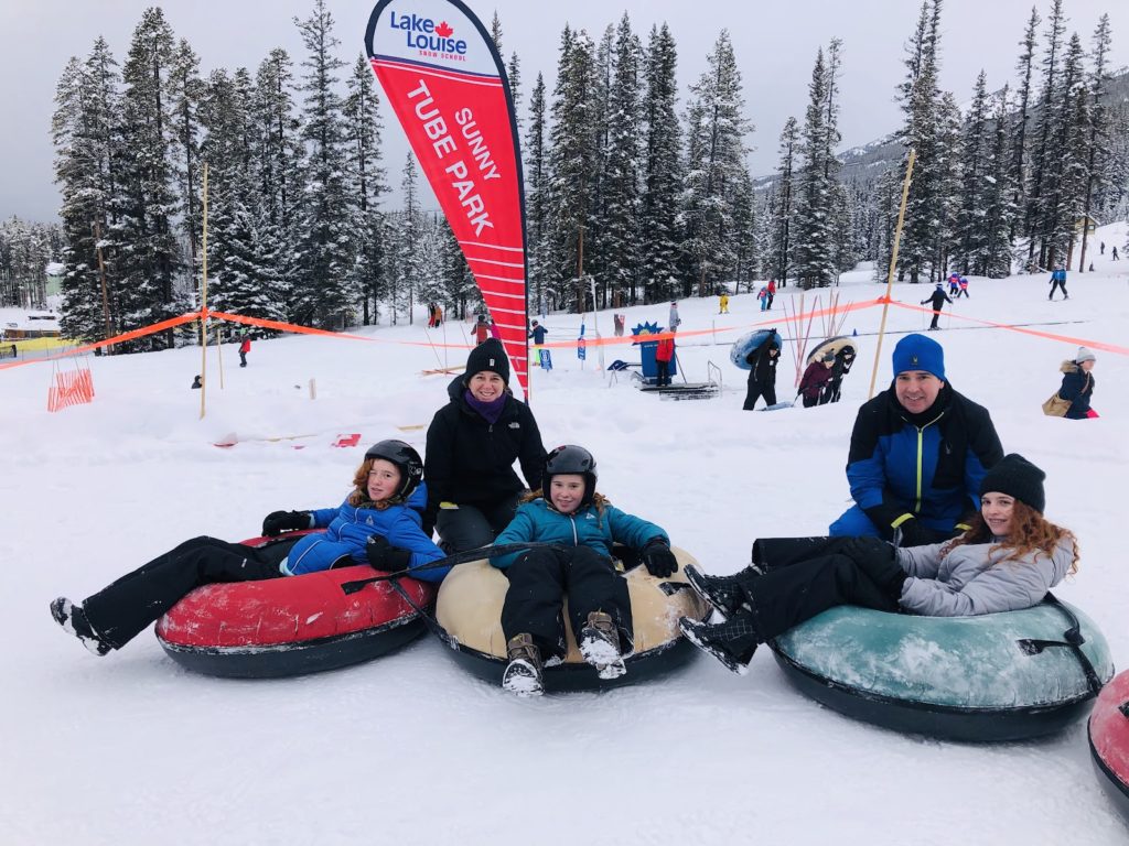 Family vacation snow tubing in Banff Lake Louise Sunny Tube Park